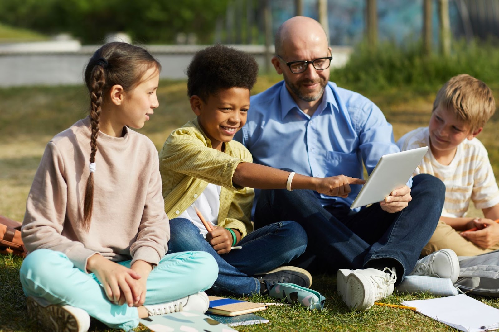 children-in-outdoor-class-with-teacher