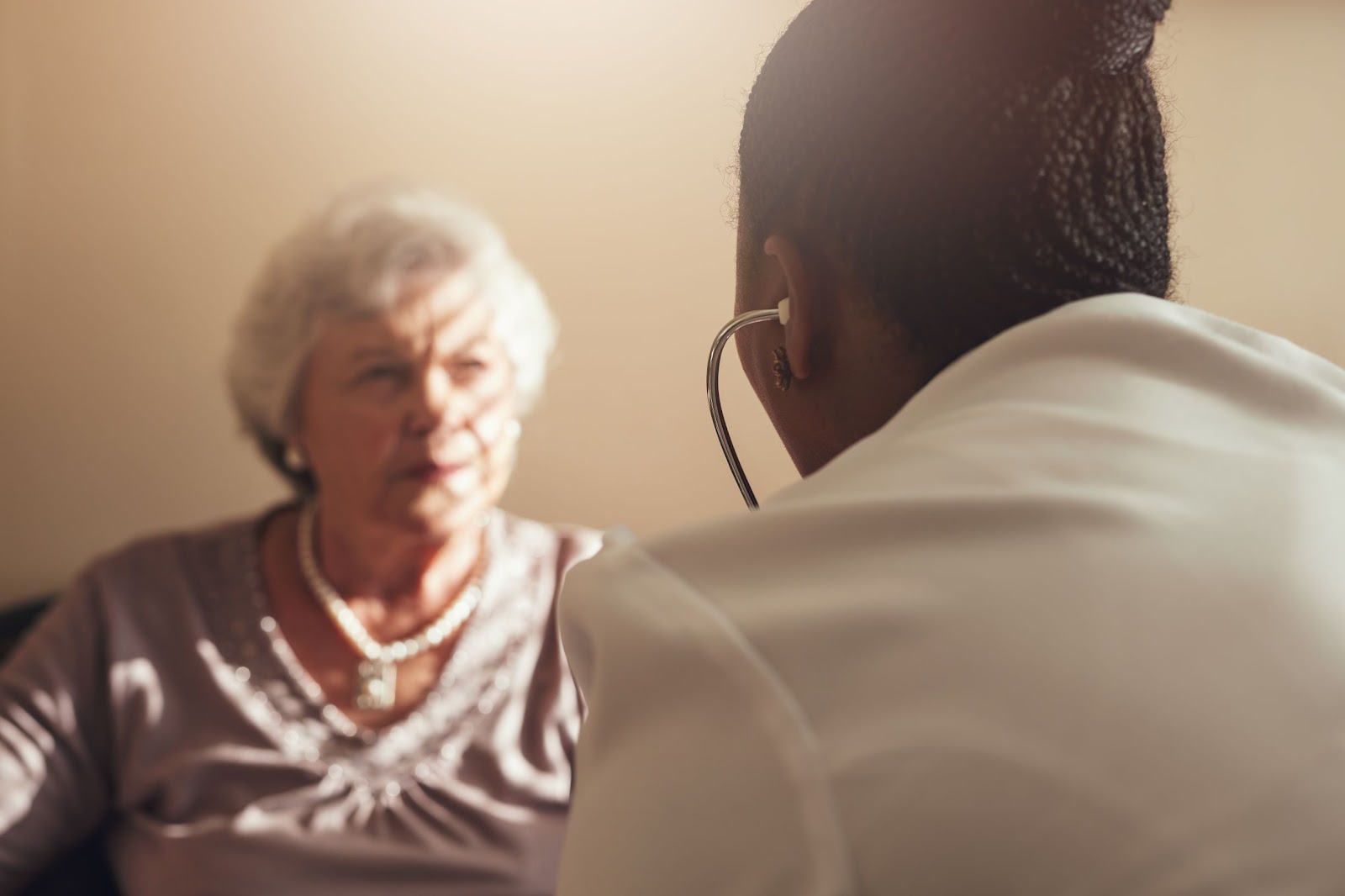 female-doctor-examining-senior-woman