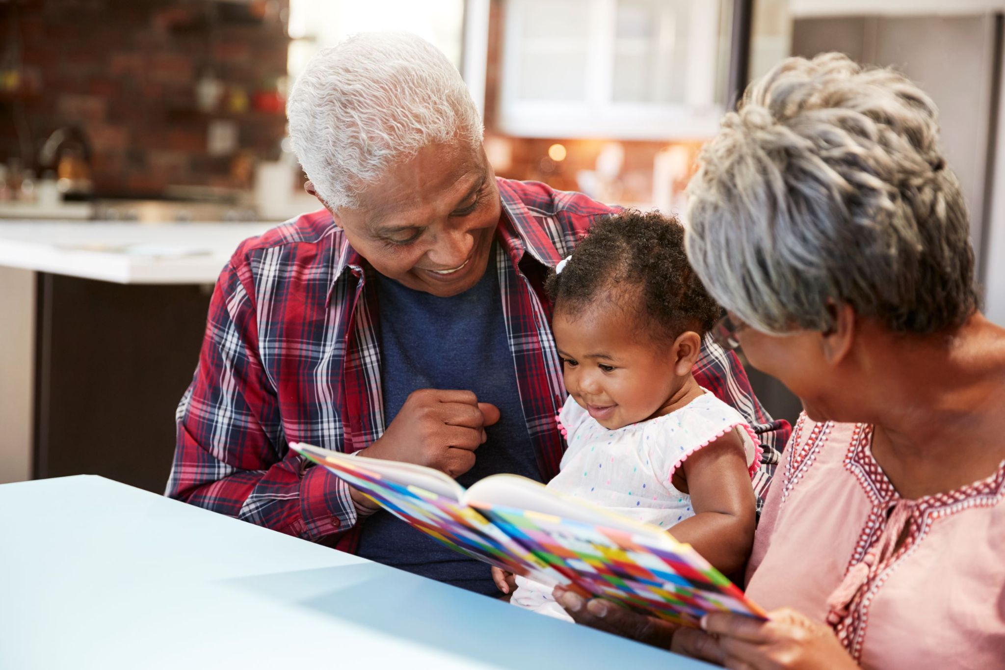 grandparents-reading-stories-to-granddaughter