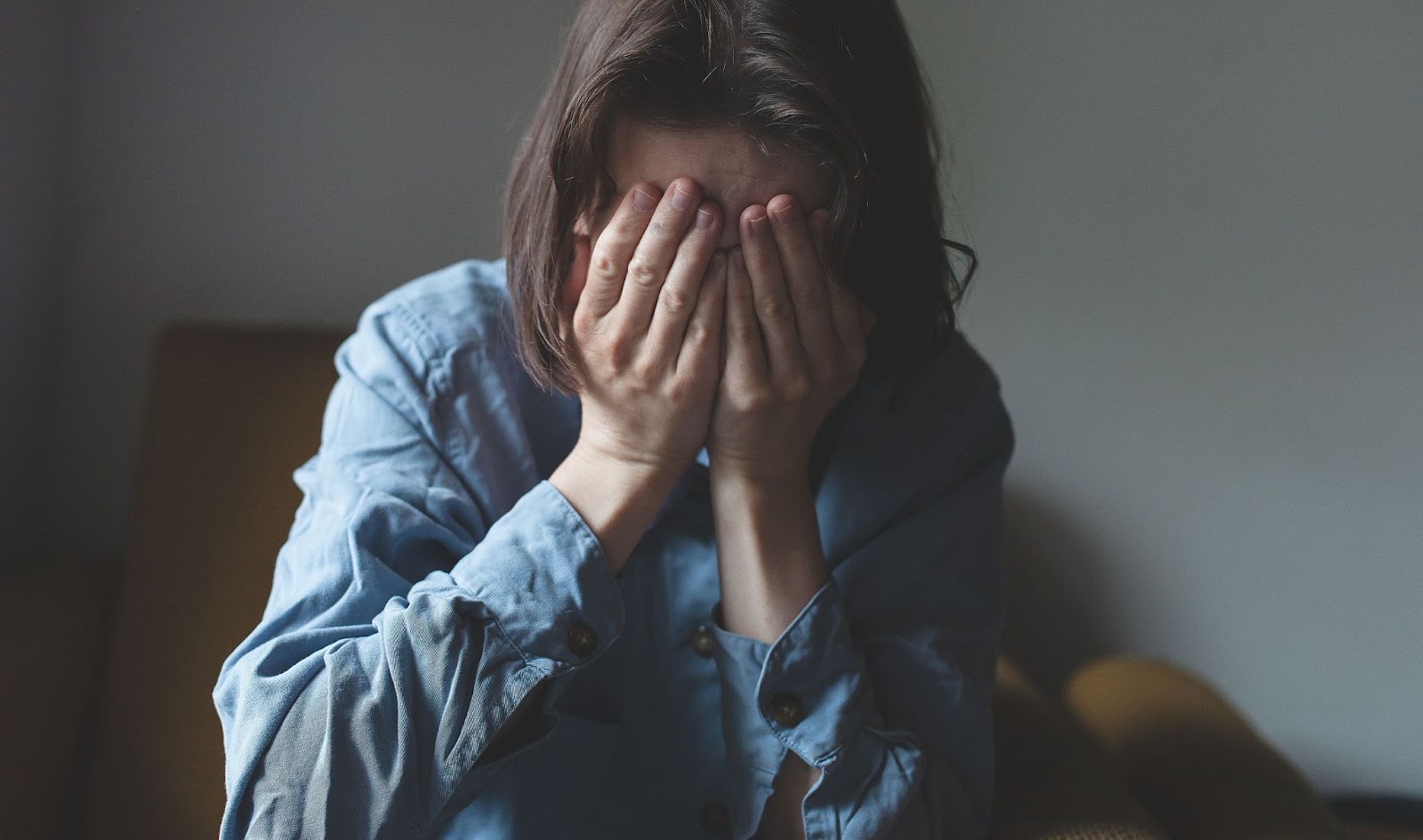 distraught-woman-with-head-in-hands