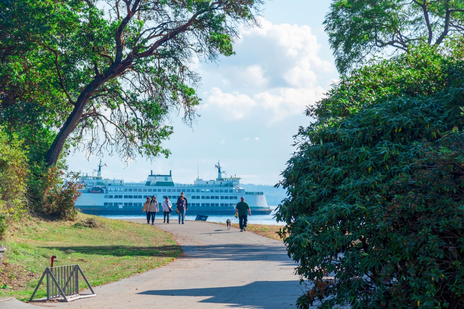 Seattle-ferry-boat-and-people-walking-on-paved-trail