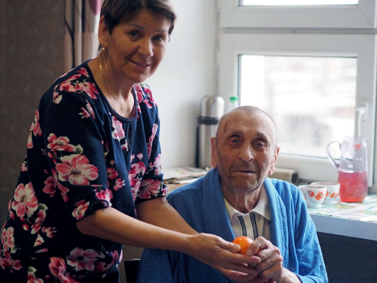 woman-in-kitchen-caring-for-grandfather