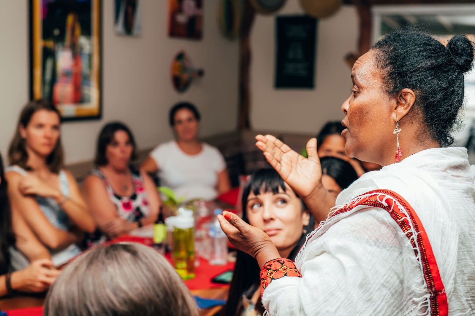 older-woman-sharing-stories-with-group-of-women