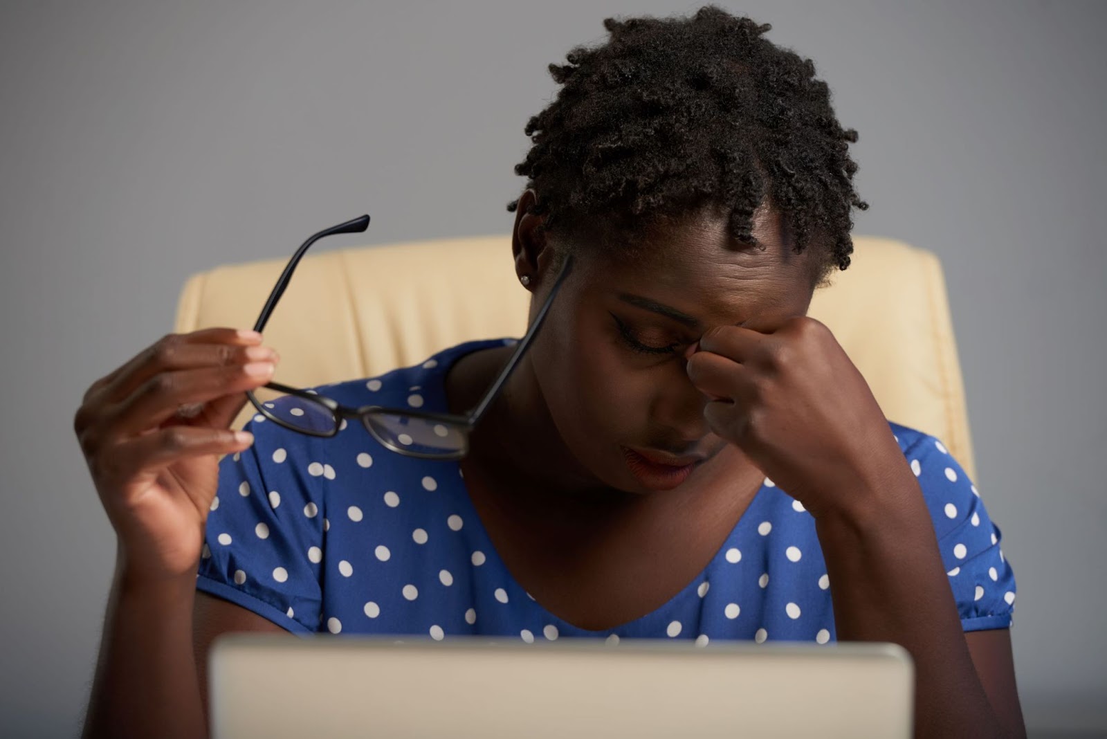 tired-woman-removing-glasses