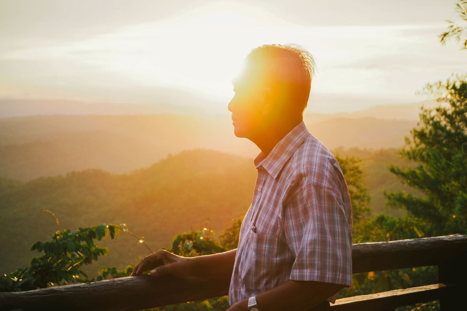 man-relaxing-and-watching-sunset