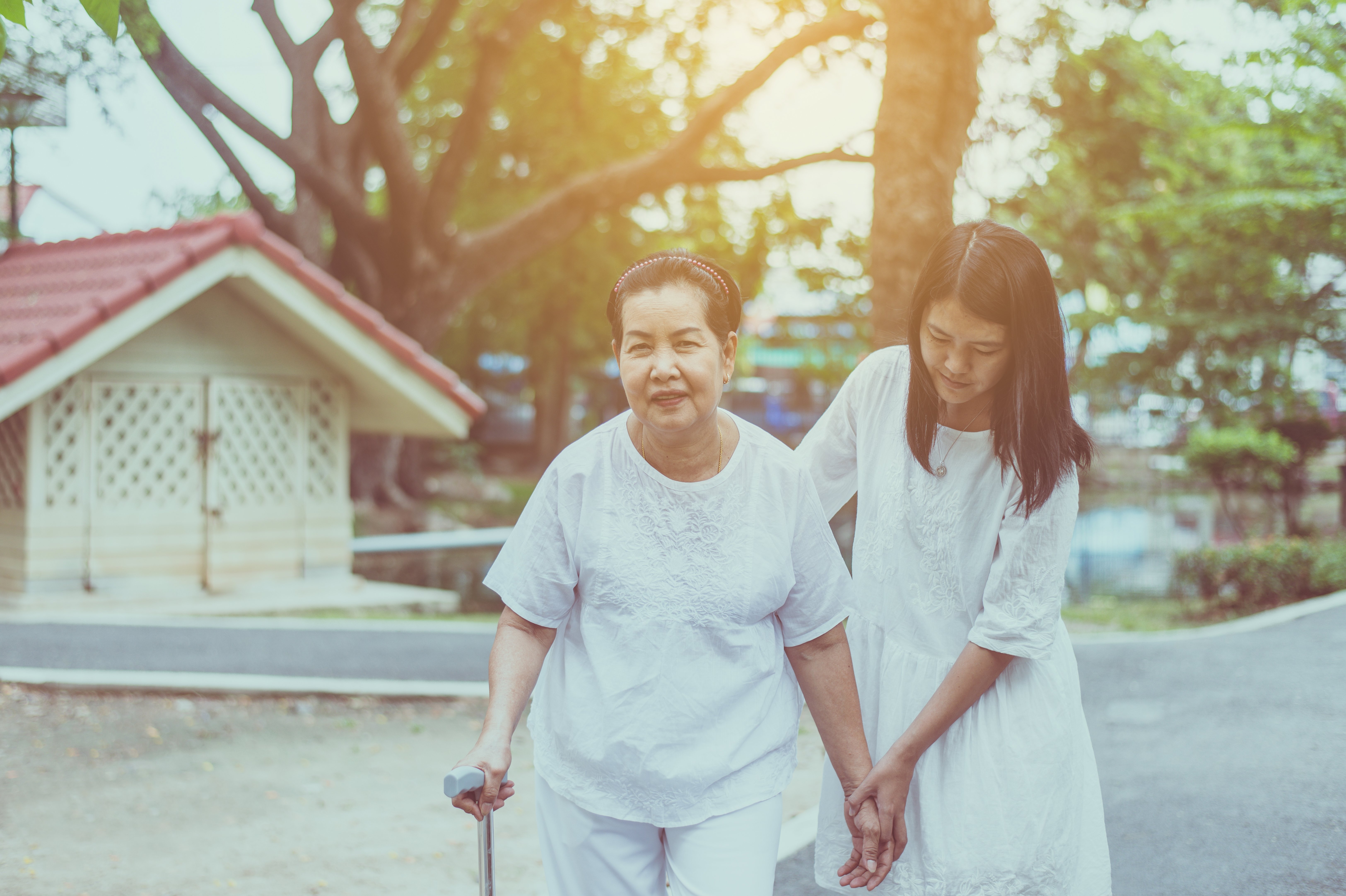 elderly-asian-female-walking-to-do-physical-with-stick-at-park-in-the-morning-daughter-take-care-and_t20_wlGrkK