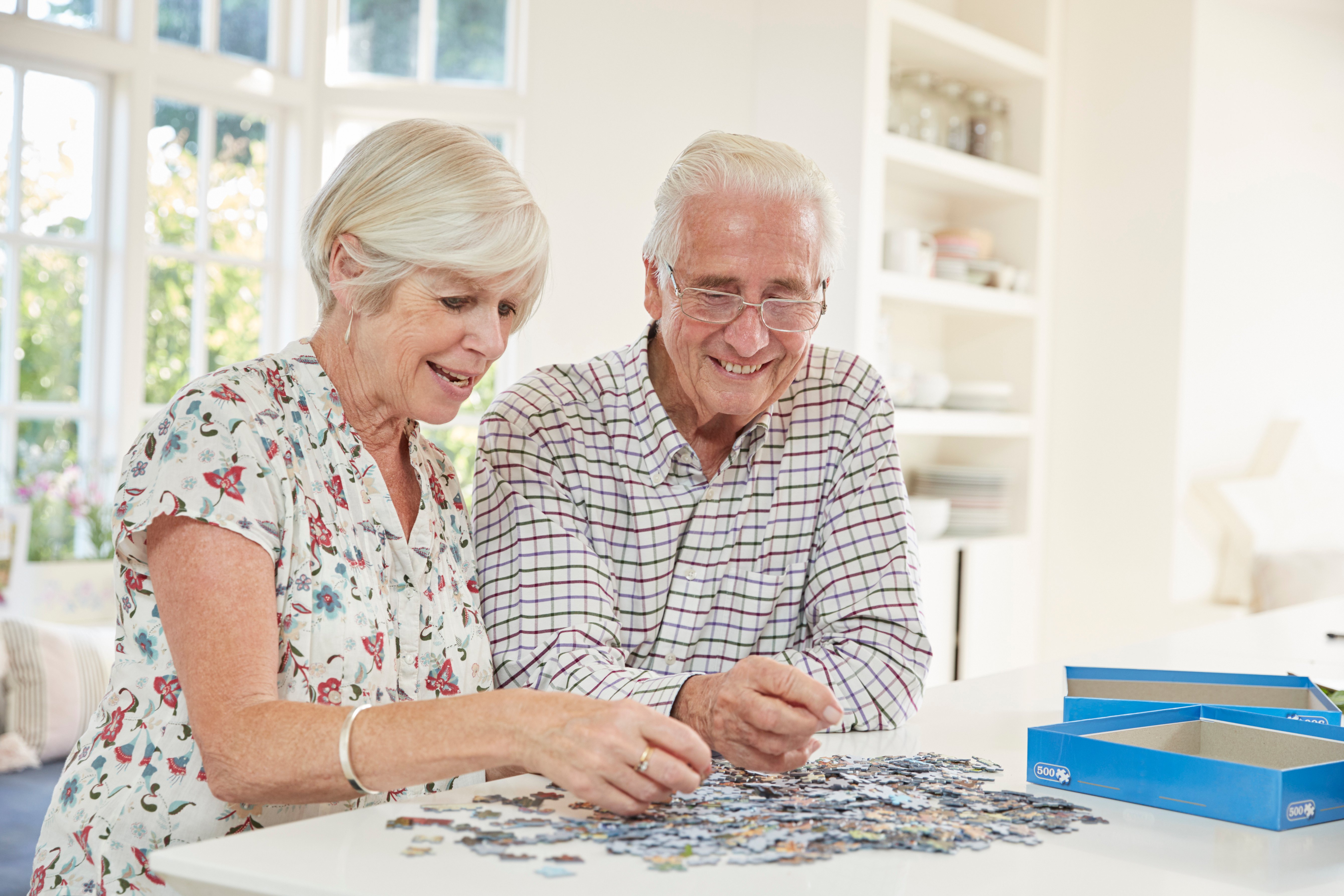 Seniors doing a puzzle