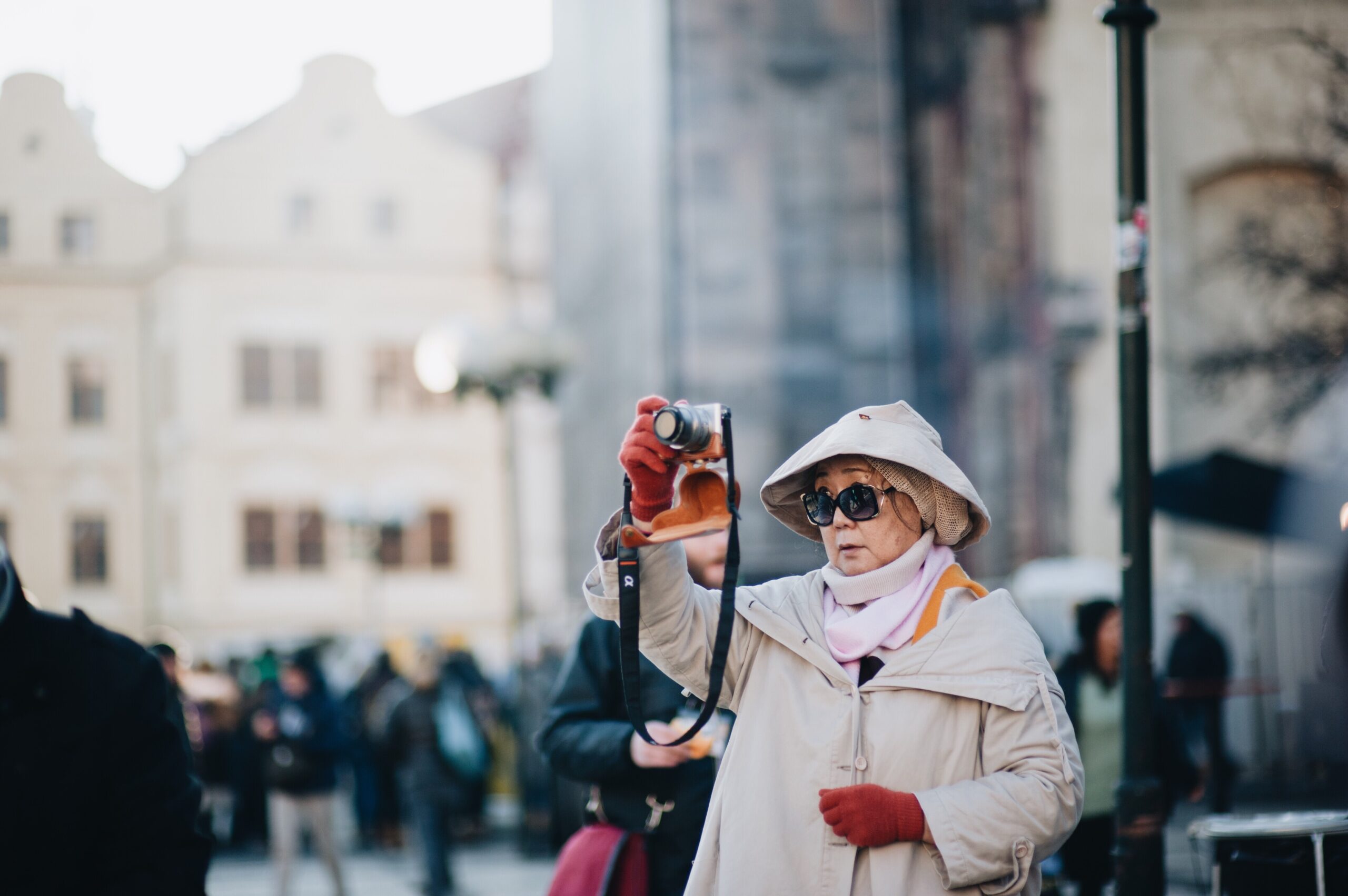 senior-tourist-taking-photos-in-street