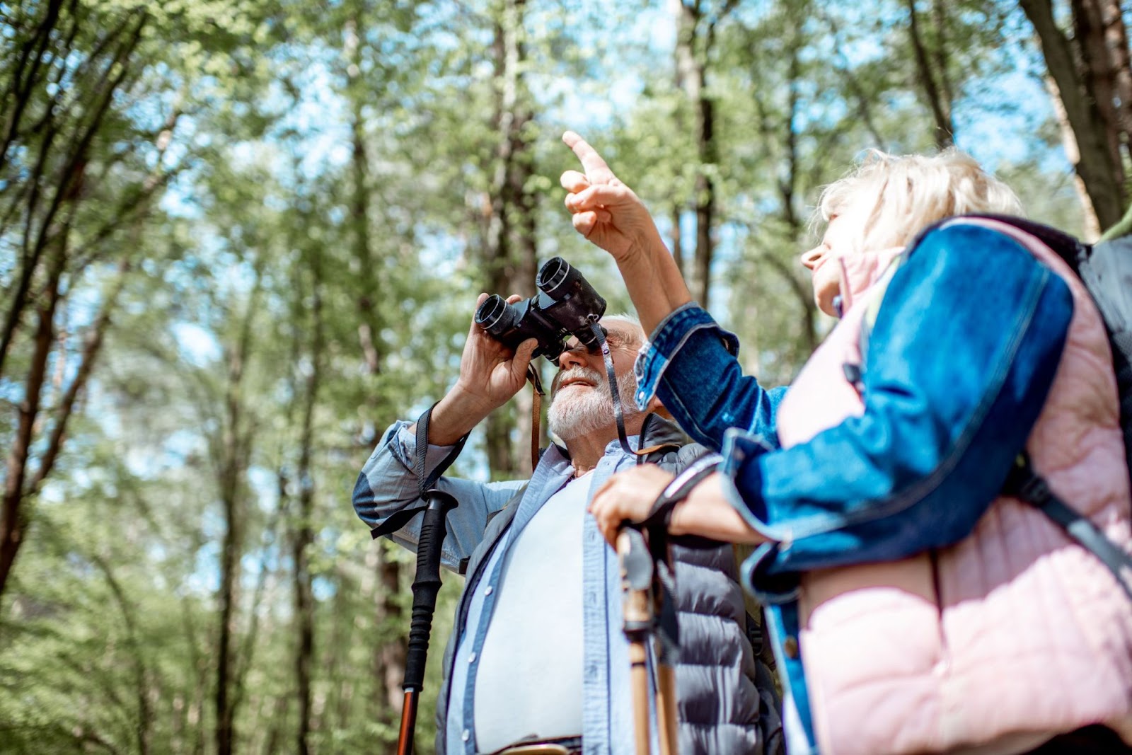 Older-couple-looking-for-wildlife-on-hike