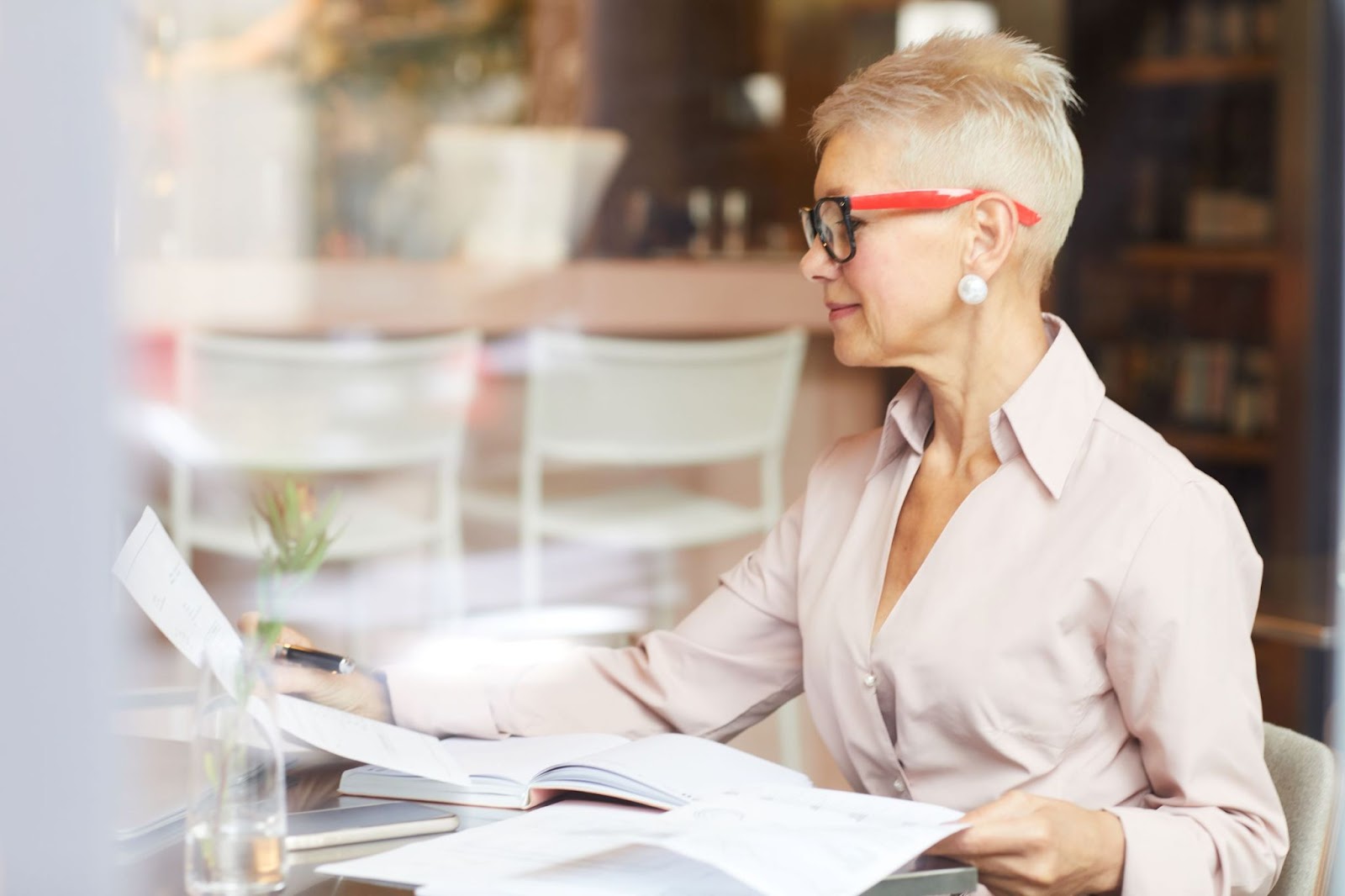 stylish-senior-woman-doing-paperwork